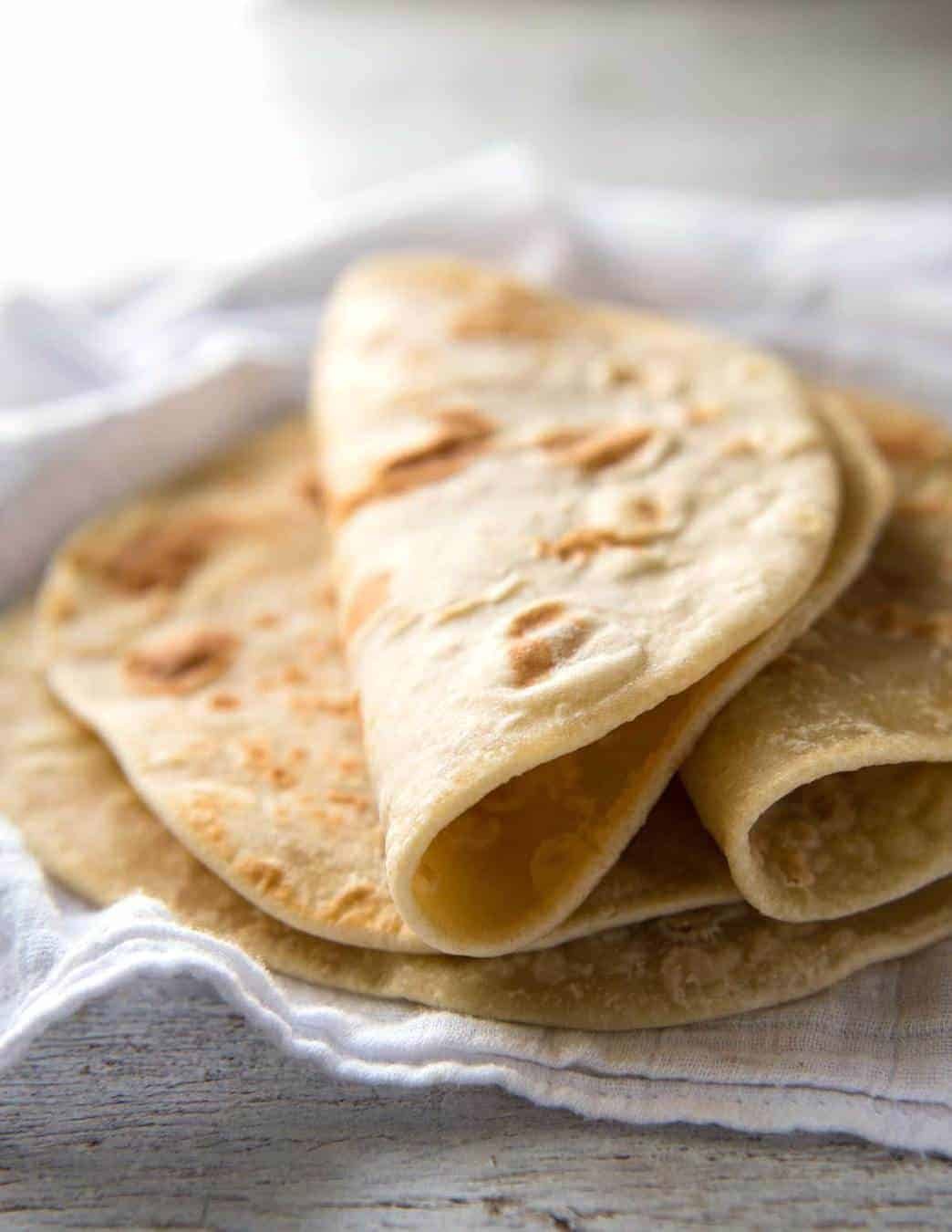 This flatbread recipe is made without yeast, yet is soft and pliable and wonderfully moist. dev.recipetineats.com