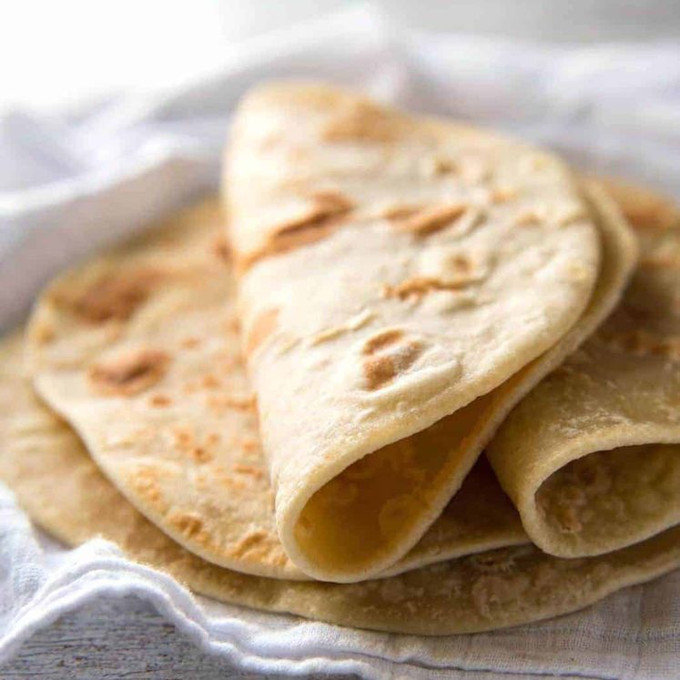 This flatbread recipe is made without yeast, yet is soft and pliable and wonderfully moist. dev.recipetineats.com