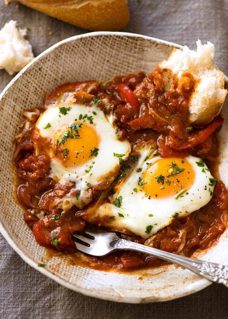 Shakshuka - Middle Eastern baked eggs in a bowl, ready to be eaten