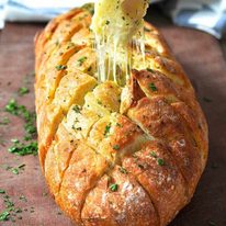 Cheese and garlic crack bread - this cheesy garlic bread is outta this world! dev.recipetineats.com