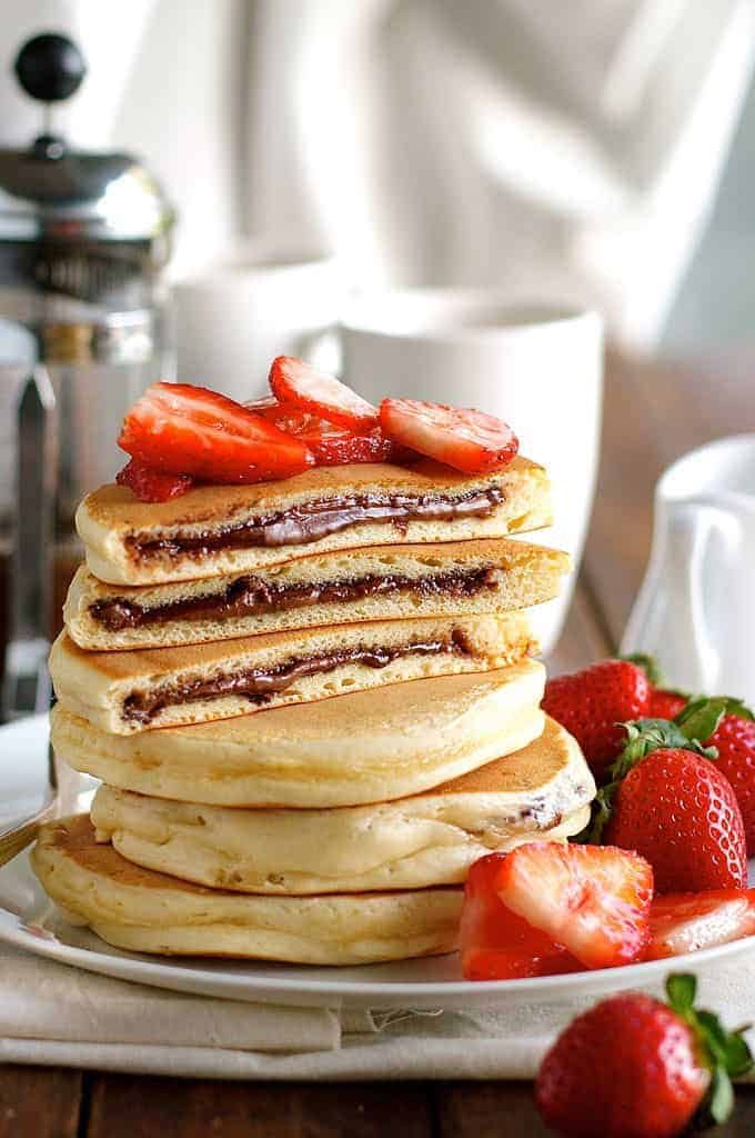 Nutella Pancakes - frozen Nutella discs makes it a breeze to make these Nutella stuffed pancakes! recipetineats.com