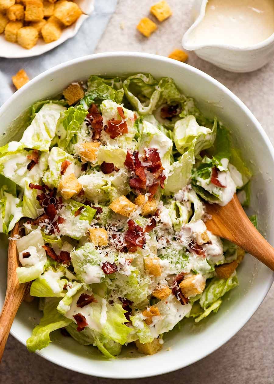 Caesar Salad in a white bowl, ready to be served