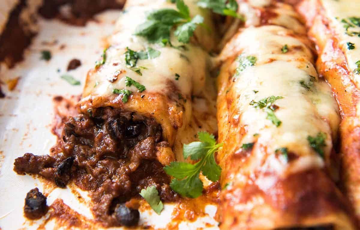 The BEST Beef Enchiladas, with an extra tasty, extra saucy filling and the most incredible homemade Enchilada Sauce! dev.recipetineats.com