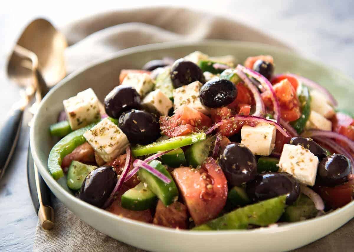 A classic Greek Salad with plump olives and a beautiful homemade Greek Salad Dressing. dev.recipetineats.com