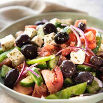 A classic Greek Salad with plump olives and a beautiful homemade Greek Salad Dressing. dev.recipetineats.com