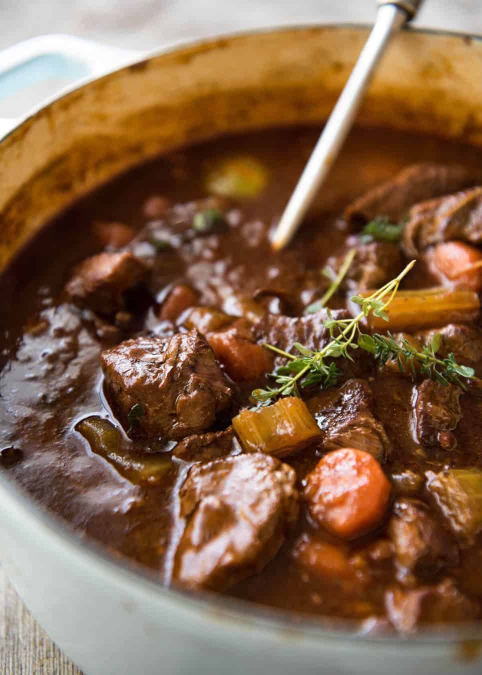 Irish Beef and Guinness Stew - The king of all stews! Fork tender beef in a rich thick sauce. Easy to make, just requires patience! Slow cooker, stove, oven and pressure cooker directions provided. dev.recipetineats.com