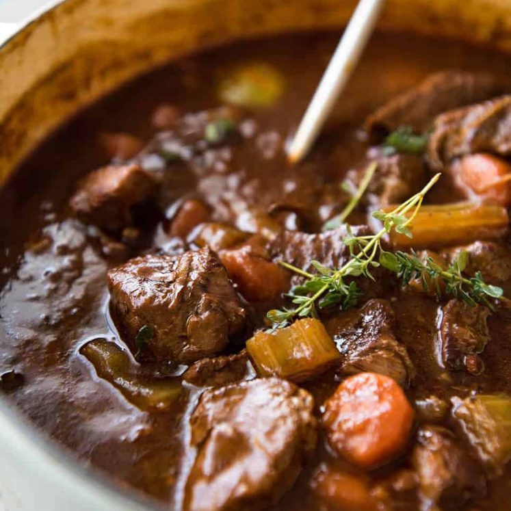 Irish Beef and Guinness Stew - The king of all stews! Fork tender beef in a rich thick sauce. Easy to make, just requires patience! Slow cooker, stove, oven and pressure cooker directions provided. dev.recipetineats.com