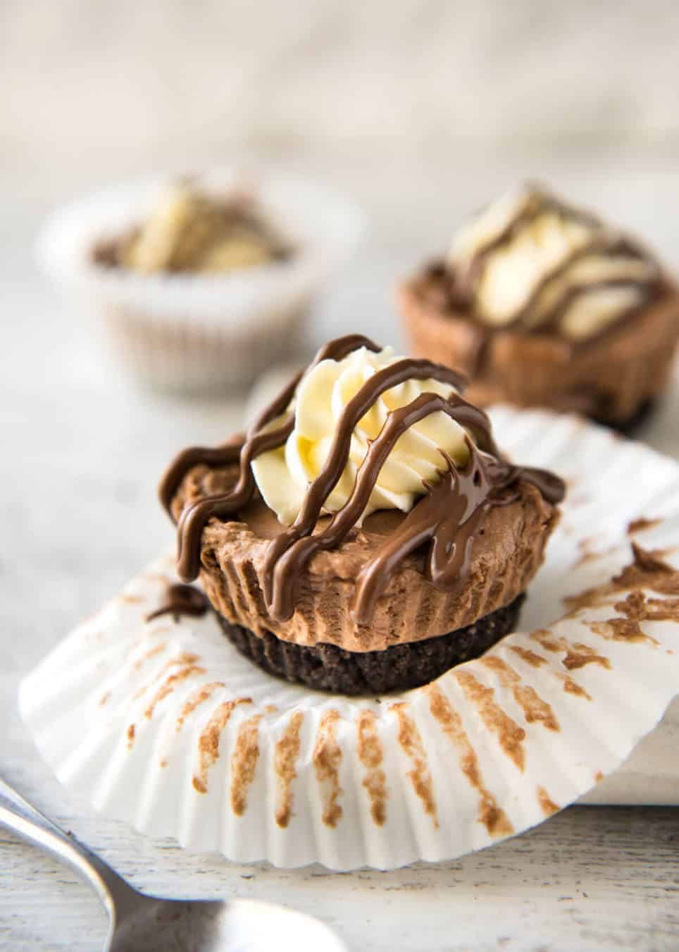 No Bake Nutella Cheesecake - Mini ones made in a muffin tin! A biscuit base and light mousse-like Nutella flavoured cheesecake. Easy to make and completely irresistible! dev.recipetineats.com