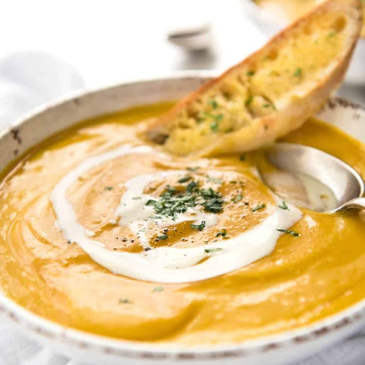 No Chop Roast Pumpkin Soup - An intensely flavoured creamy pumpkin soup made without chopping / peeling pumpkin. dev.recipetineats.com
