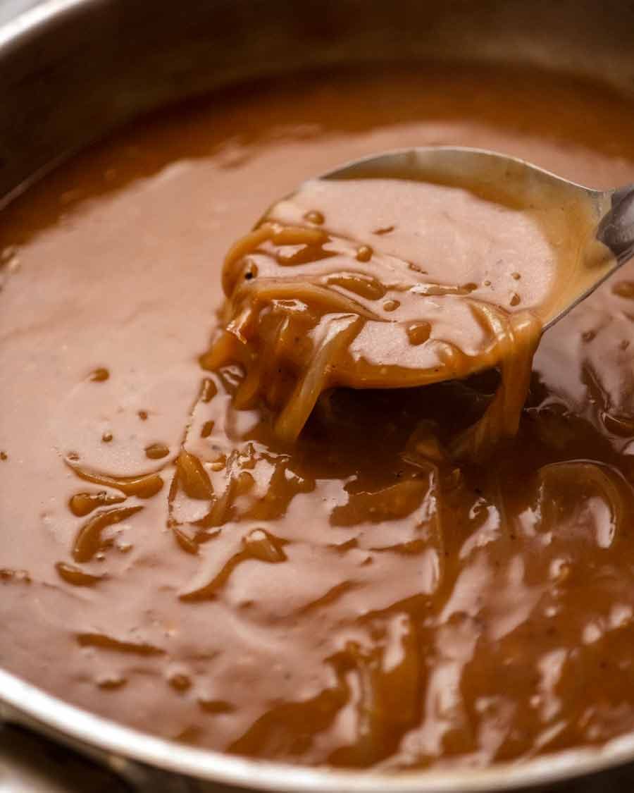 Close up of onion gravy for Bangers and Mash (Sausage with Onion Gravy)