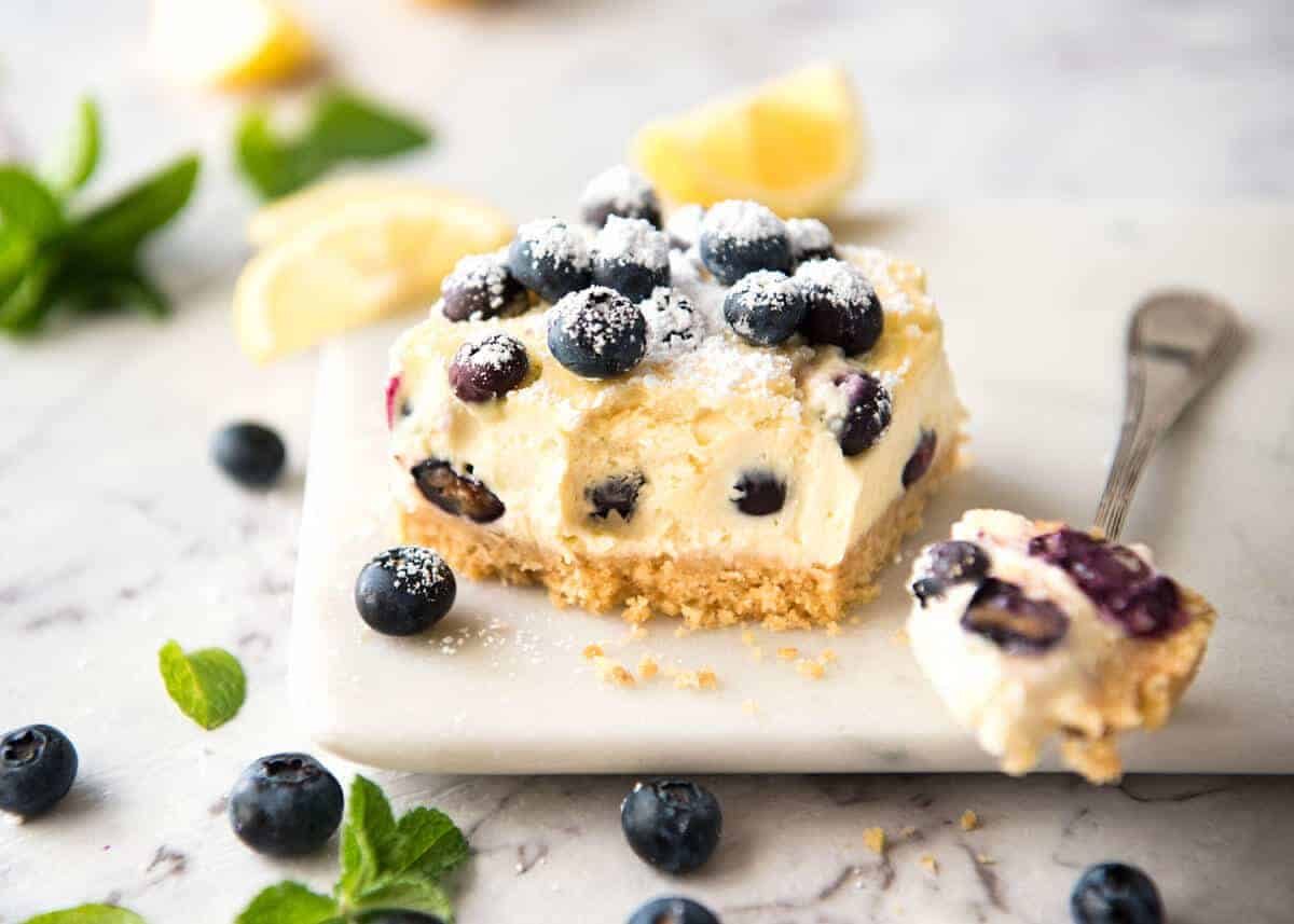 These Blueberry Cheesecake Bars are light yet creamy and luscious. Filled with soft blueberries, this is a baked cheesecake that's so easy to make! dev.recipetineats.com