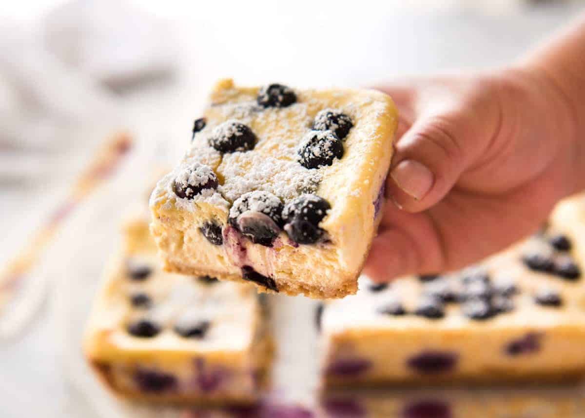 These Blueberry Cheesecake Bars are light yet creamy and luscious. Filled with soft blueberries, this is a baked cheesecake that's so easy to make! dev.recipetineats.com