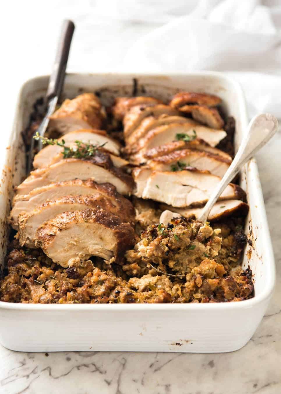 This Cajun dry brined turkey breast is baked in the same roasting pan as the Dressing / Stuffing so it's extra juicy and moist! A chef recipe, this Cajun Baked Turkey Breast with Dressing is easy and spectacular. EPIC ONE PAN COOKING for a Thanksgiving turkey! dev.recipetineats.com