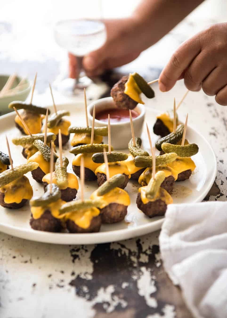 Cheeseburger Party Meatballs - tastes like a cheeseburger, in bite size form! Great for making ahead - fully assemble (inc toothpicks), 90 sec reheat in microwave. dev.recipetineats.com