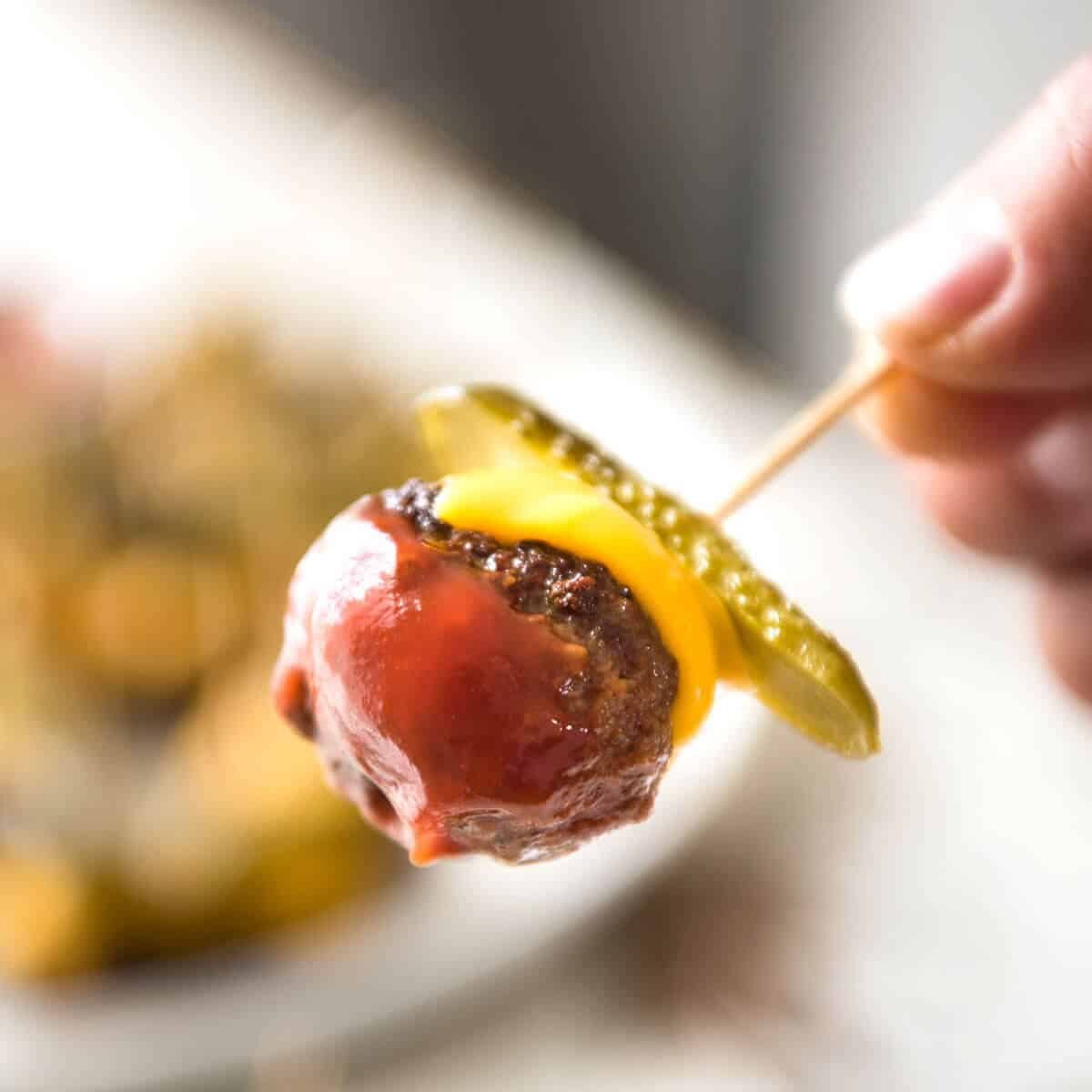 Cheeseburger Party Meatballs - tastes like a cheeseburger, in bite size form! Great for making ahead - fully assemble (inc toothpicks), 90 sec reheat in microwave. dev.recipetineats.com