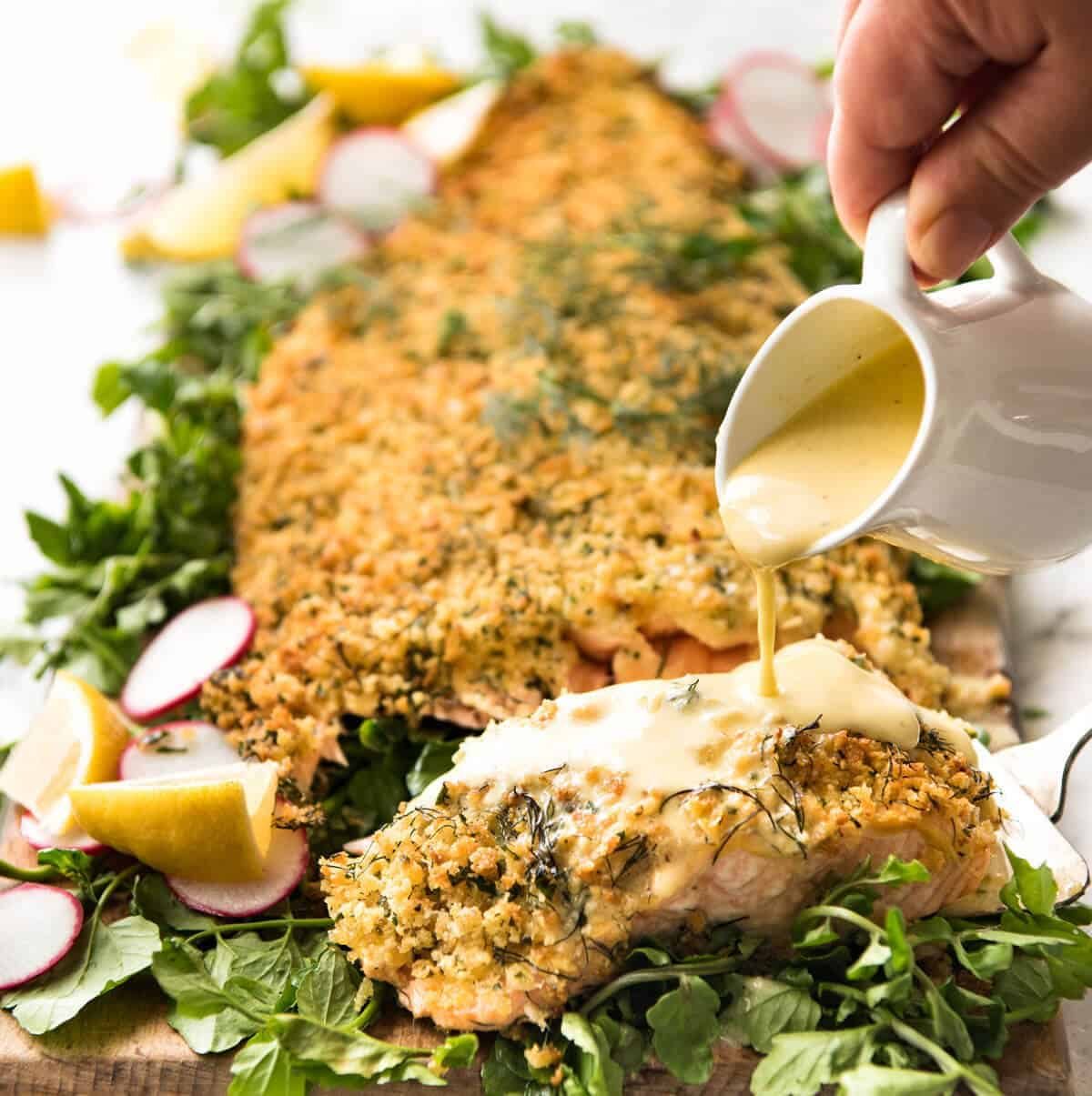 Baked Parmesan Crusted Salmon with Lemon Cream Sauce - easy and fast to make, can be prepared ahead, a stunning centrepiece for Christmas dinner and yet easy enough for midweek. That Lemon Cream sauce is the perfectly finishing tough. dev.recipetineats.com