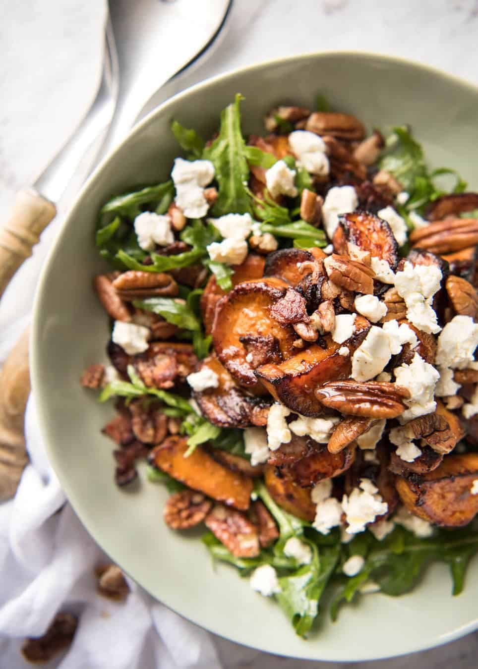 Roasted Sweet Potato Salad - with arugula/rocket, pecans, goats cheese or feta, a sprinkle of bacon and a beautiful Honey Lemon dressing. dev.recipetineats.com