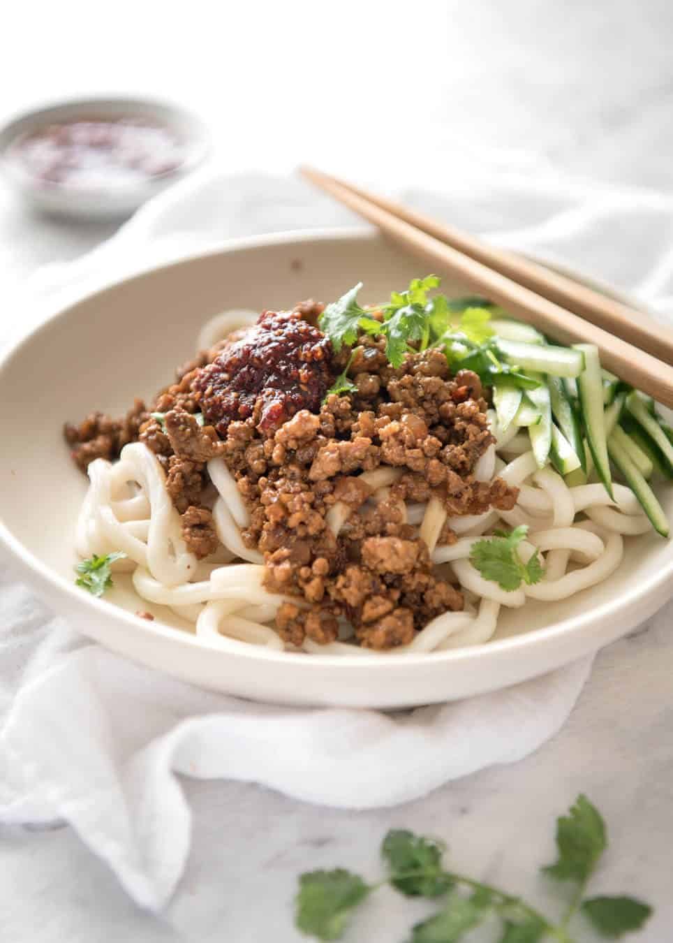 Chinese Pork with Noodles (Zha Jiang Mian) - Super quick and super tasty, affectionally known as "Chinese Bolognese". The pork is savoury with a touch of heat and spice, perfect mixed through noodles! dev.recipetineats.com