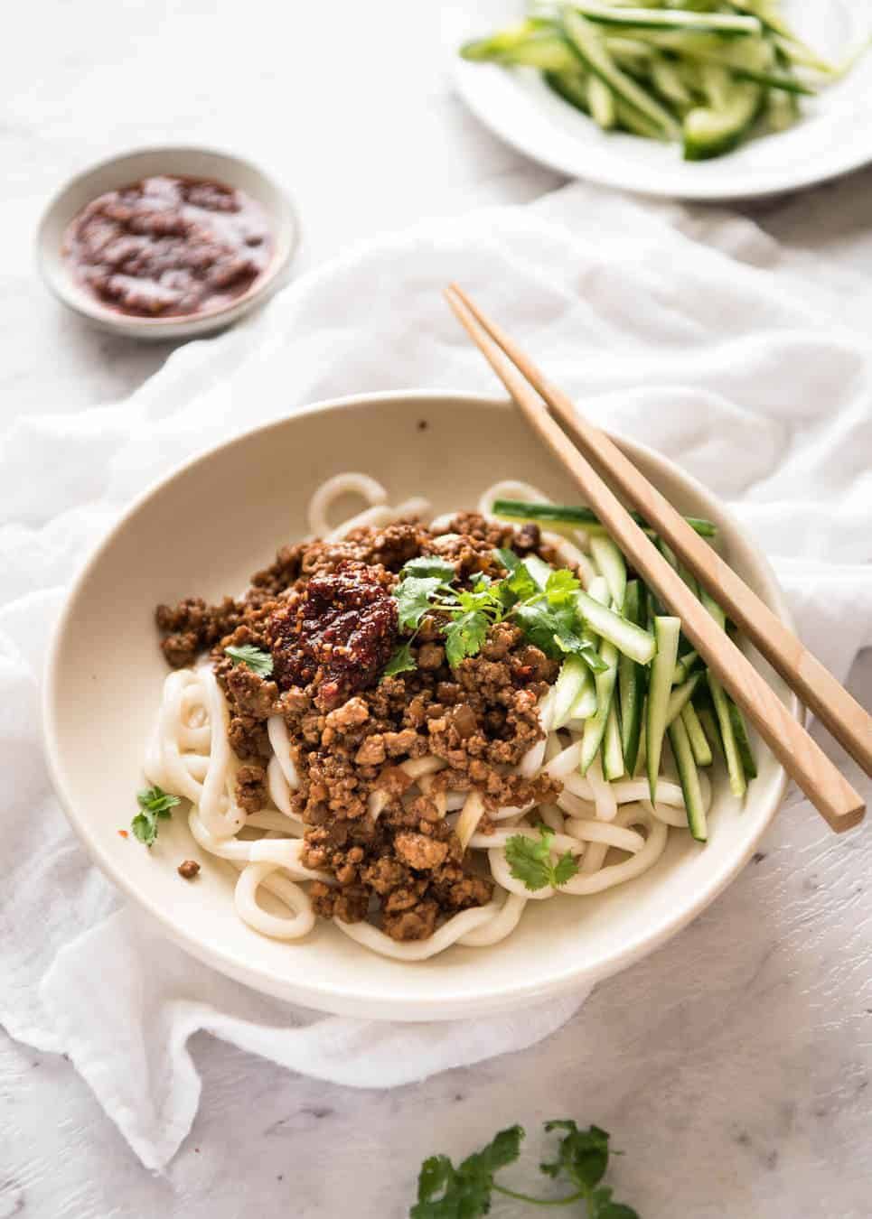 Chinese Pork Mince with Noodles (Zha Jiang Mian) - Super quick and super tasty, affectionally known as "Chinese Bolognese". The pork is savoury with a touch of heat and spice, perfect mixed through noodles! dev.recipetineats.com