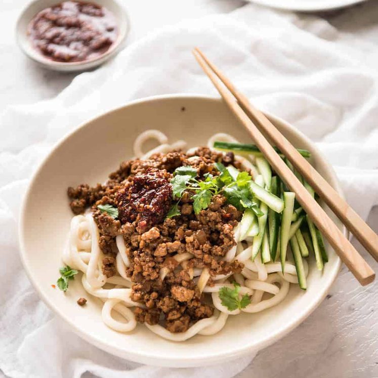 Chinese Pork with Noodles (Zha Jiang Mian) - Super quick and super tasty, affectionally known as "Chinese Bolognese". The pork is savoury with a touch of heat and spice, perfect mixed through noodles! dev.recipetineats.com