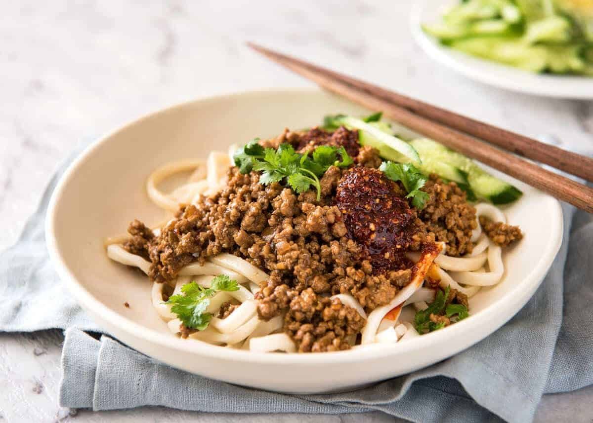 Chinese Pork with Noodles (Zha Jiang Mian) - Super quick and super tasty, affectionally known as "Chinese Bolognese". The pork is savoury with a touch of heat and spice, perfect mixed through noodles! dev.recipetineats.com