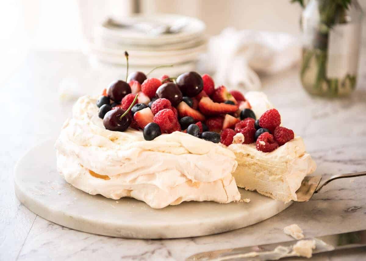Classic Pavlova recipe with easy to follow tips that make all the difference for a perfect Pav, every time! dev.recipetineats.com