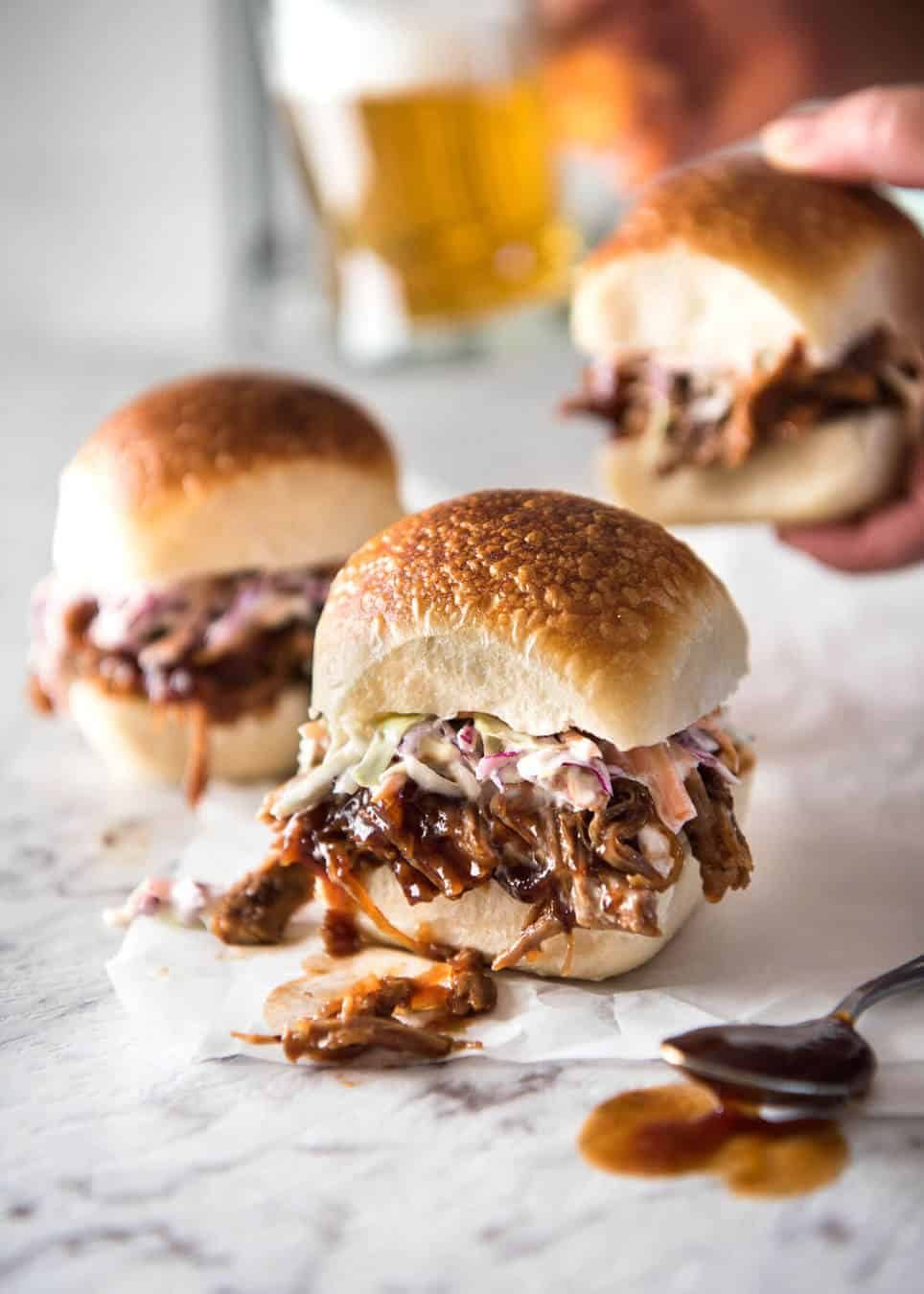 Slow Cooker BBQ Pulled Pork Sandwich - Perfectly seasoned, tender pulled pork tossed in a homemade BBQ sauce, piled onto bread with coleslaw. Slow cooker, pressure cooker or oven. dev.recipetineats.com