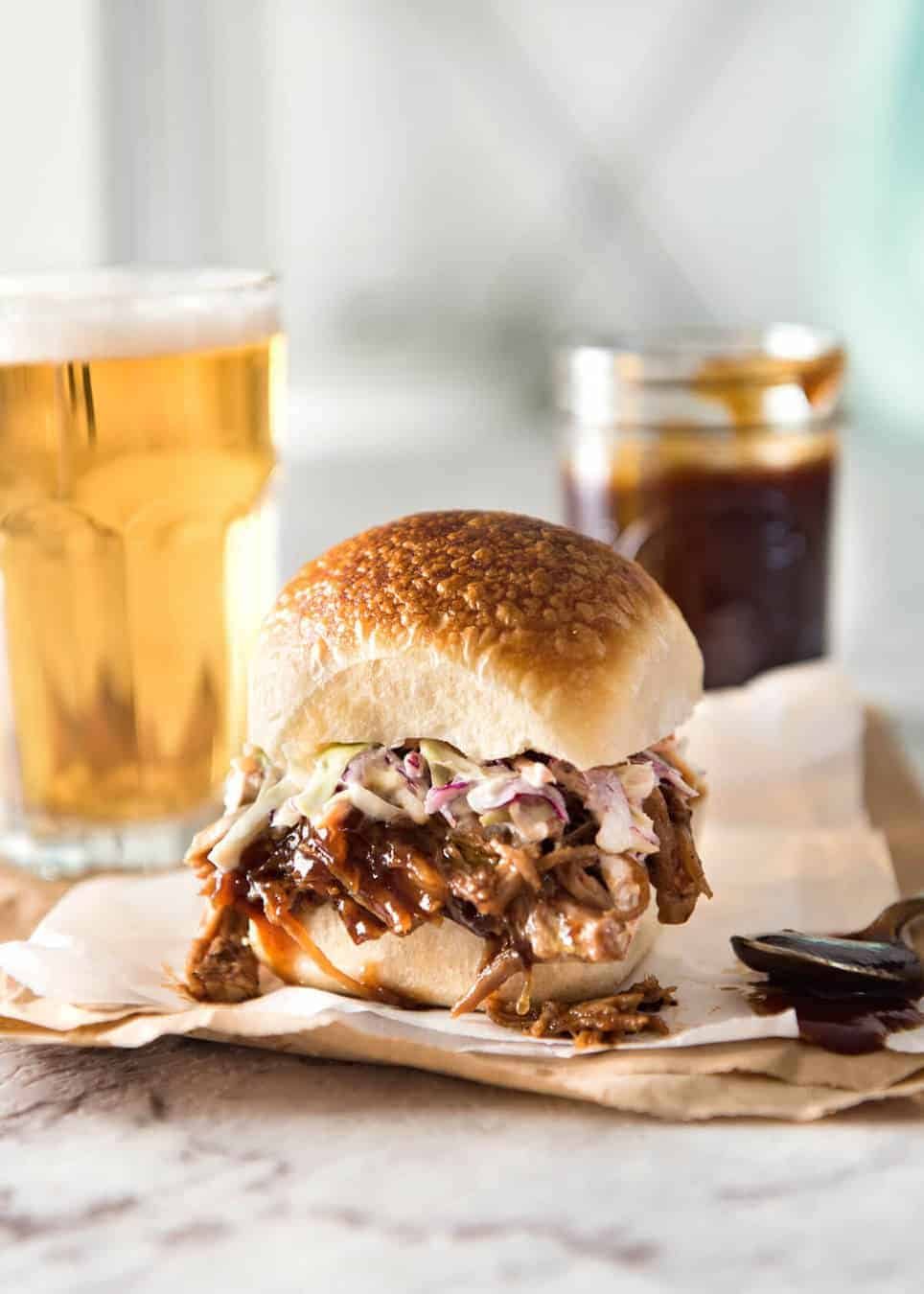 Slow Cooker BBQ Pulled Pork Sandwich - Perfectly seasoned, tender pulled pork tossed in a homemade BBQ sauce, piled onto bread with coleslaw. Slow cooker, pressure cooker or oven. dev.recipetineats.com