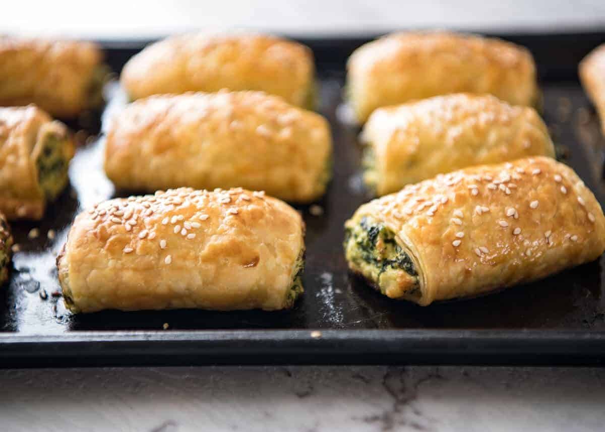 Spinach and Ricotta Rolls - a moist cheesy filling enclosed with buttery flaky puff pastry. Great make ahead for freezing! dev.recipetineats.com