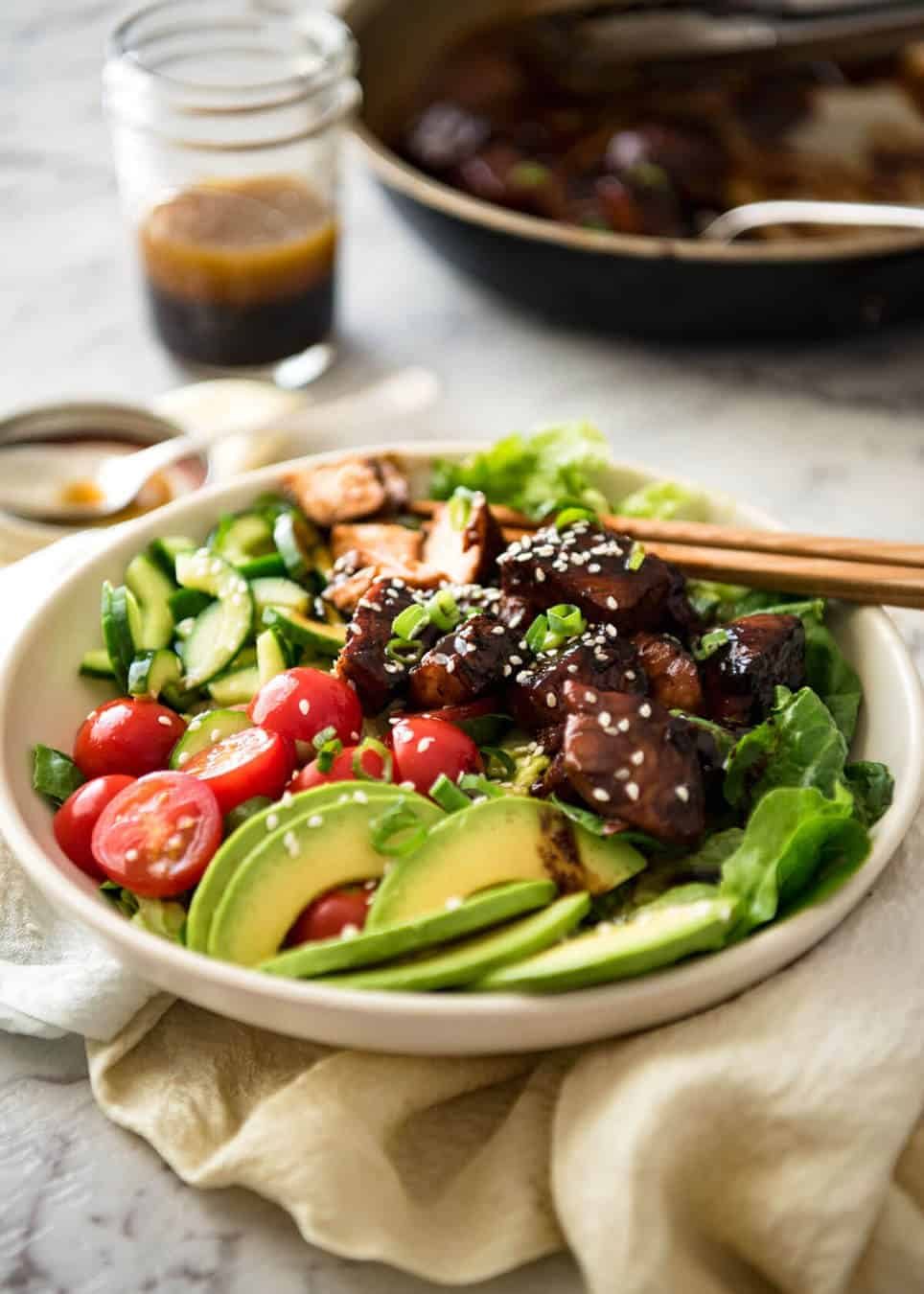 Asian Salmon Salad - Salmon dripping in a gorgeous Asian glaze on a fresh, vibrant salad drizzled with sesame dressing. Quick to make, packed with serious flavour! dev.recipetineats.com