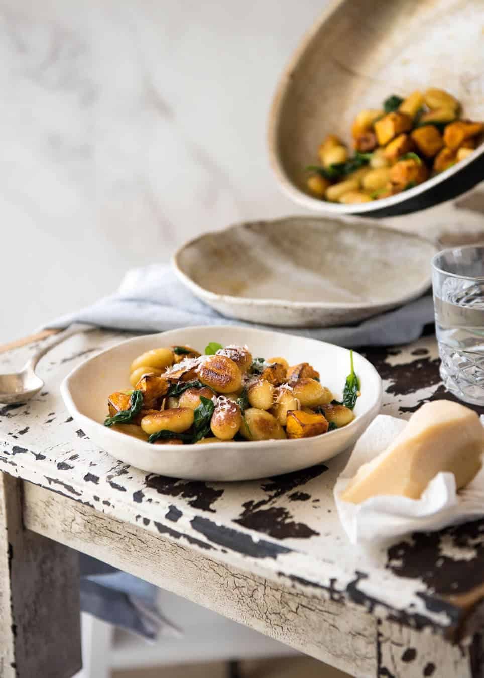 Pan Fried Gnocchi with Pumpkin and Spinach - Golden crispy on the outside, soft on the inside, with a butter sage sauce, roasted pumpkin and spinach. dev.recipetineats.com