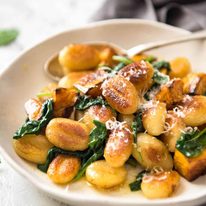 Pan Fried Gnocchi with Pumpkin and Spinach - Golden crispy on the outside, soft on the inside, with a butter sage sauce, roasted pumpkin and spinach. dev.recipetineats.com