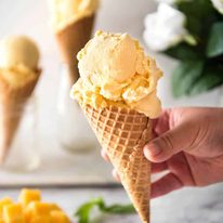 Homemade Mango Ice Cream recipe - Made without an ice cream maker, all you need is mangoes, condensed milk and cream to make this Mango Ice Cream recipe that is truly creamy and scooopable. The real mango flavour is incredible! dev.recipetineats.com