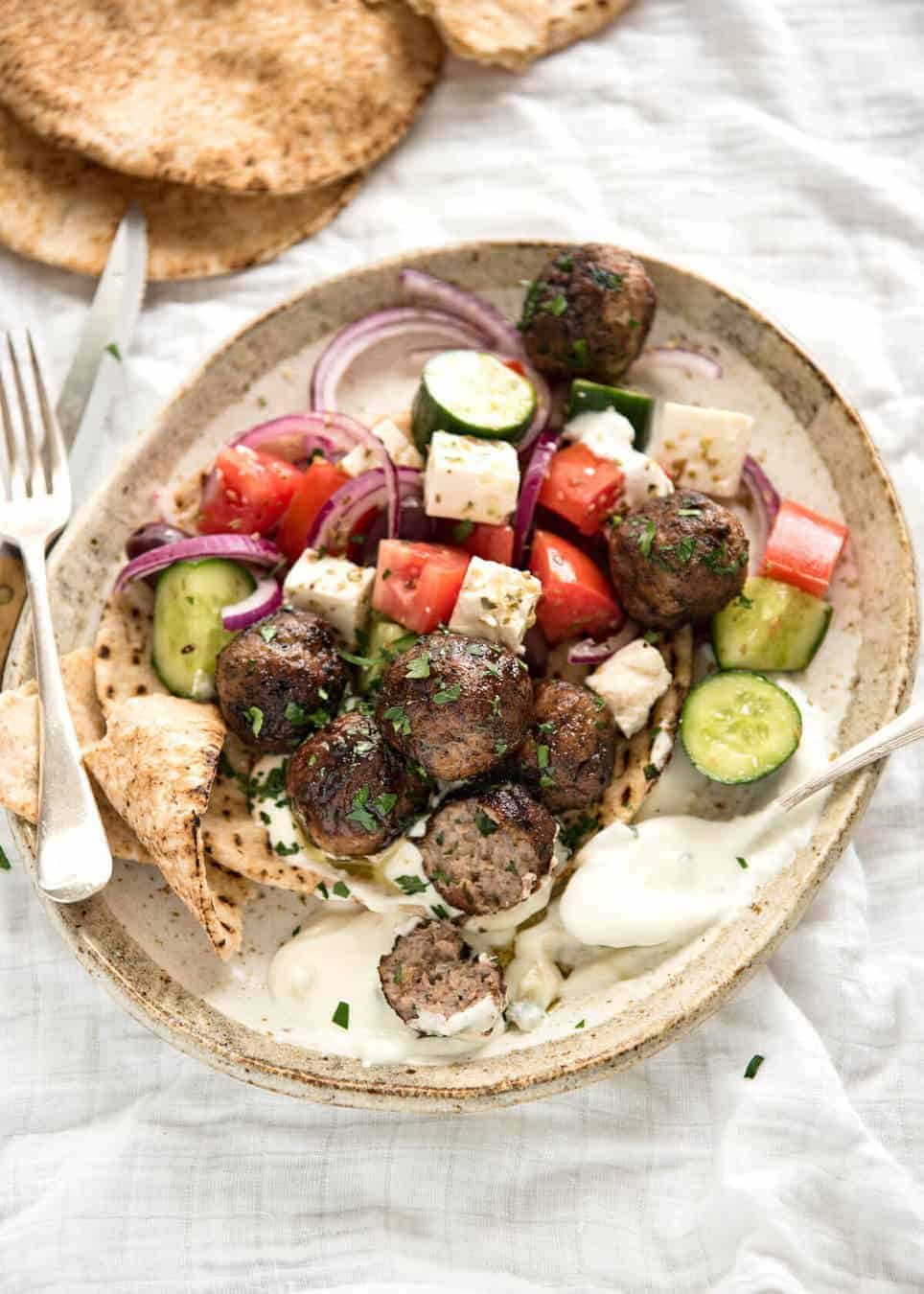 Soft, juicy, beautifully flavoured GREEK MEATBALLS! Serve as an appetiser with tzatziki, main with Greek Salad or make wraps! dev.recipetineats.com