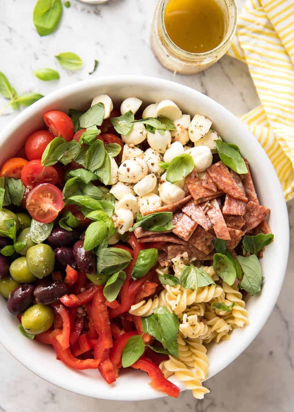 This Italian Pasta Salad with Homemade Italian Dressing is a hit at gatherings! dev.recipetineats.com