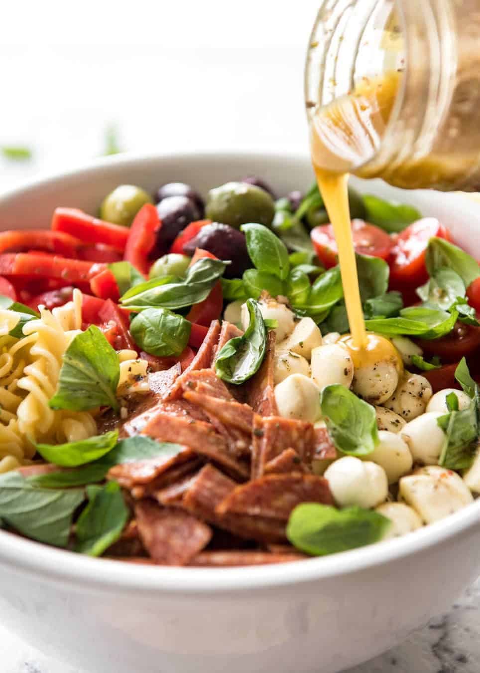 This Italian Pasta Salad with Homemade Italian Dressing is a hit at gatherings! dev.recipetineats.com
