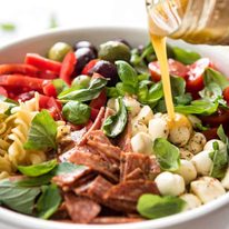 This Italian Pasta Salad with Homemade Italian Dressing is a hit at gatherings! dev.recipetineats.com