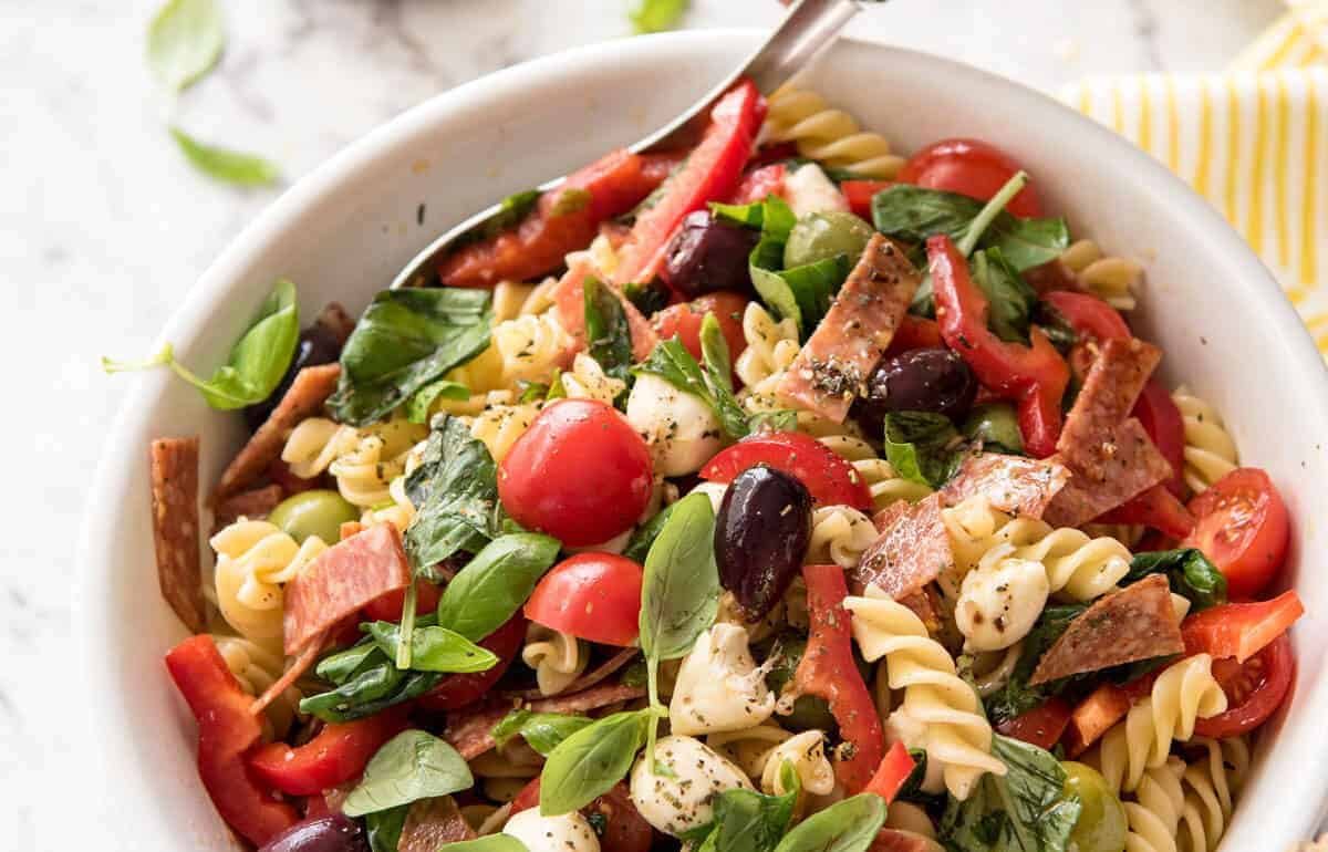 This Italian Pasta Salad with Homemade Italian Dressing is a hit at gatherings! dev.recipetineats.com