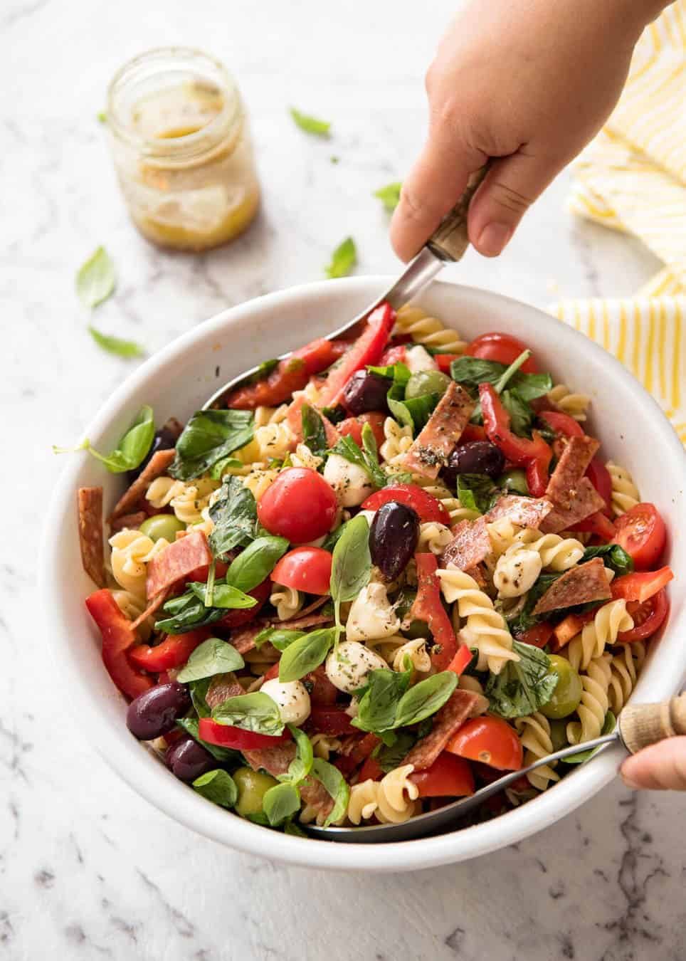 This Italian Pasta Salad with Homemade Italian Dressing is a hit at gatherings! dev.recipetineats.com