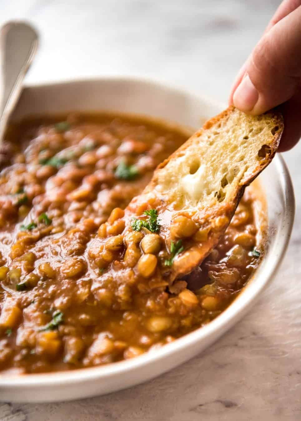 Why settle for a bland Lentil Soup when you make a standout one? Just a hint of spices and finishing it off with lemon zest makes all the difference! dev.recipetineats.com