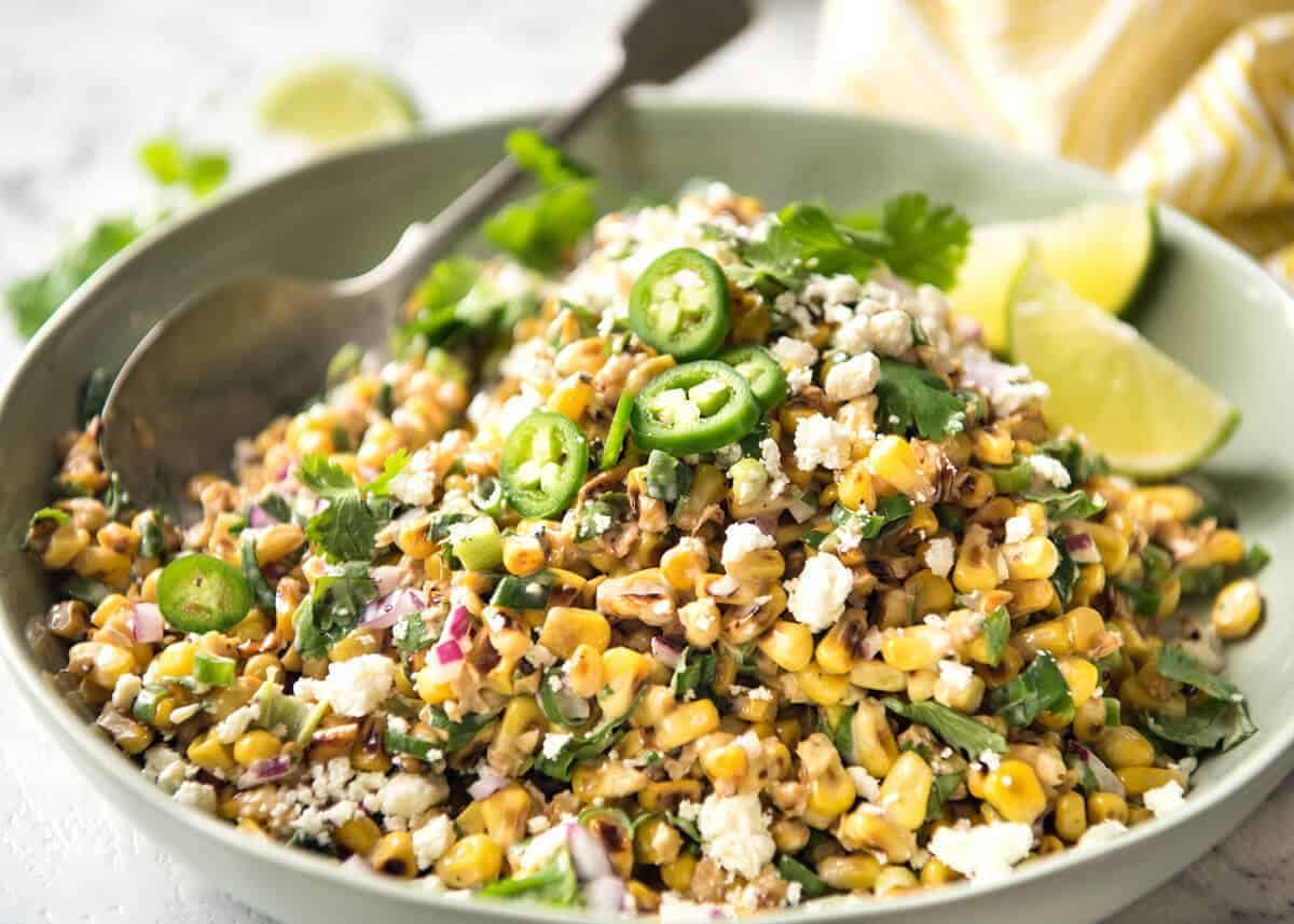 Mexican Corn Salad - Inspired by the famous Mexican street corn, this is a terrific way to use corn for an irresistible side! dev.recipetineats.com