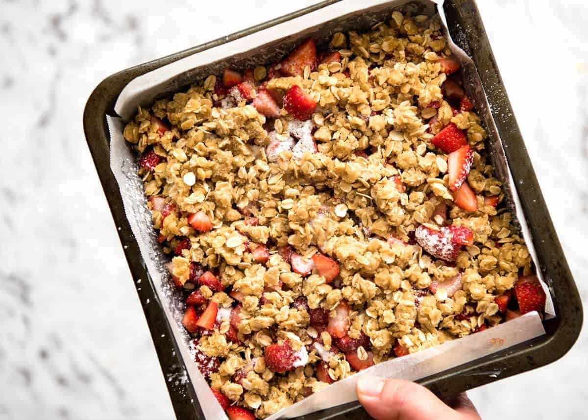 Fresh Strawberry Bars with a buttery biscuit base, topped with jam, fresh strawberries and a crumbly topping. No mixer, quick to make! dev.recipetineats.com