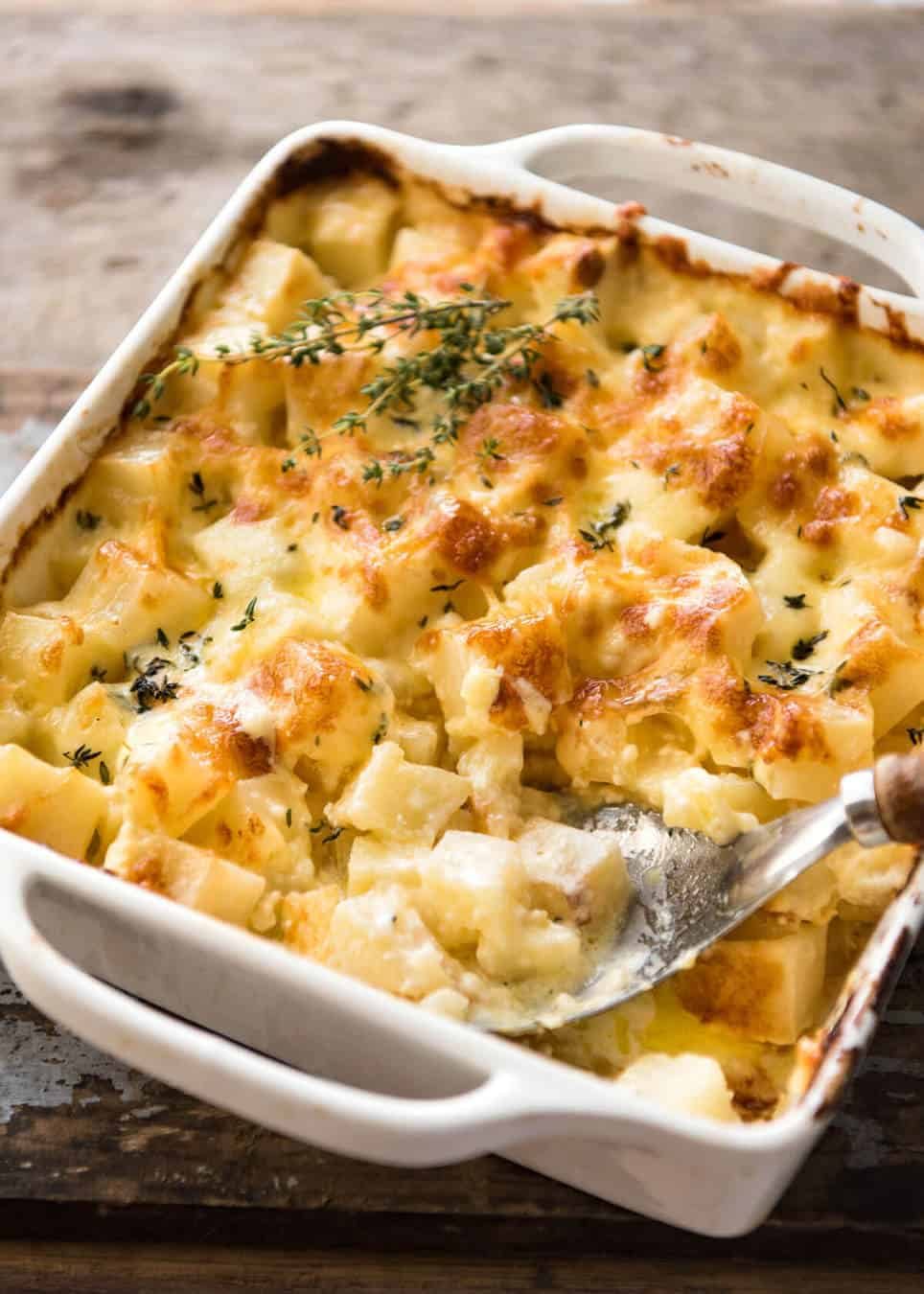 A faster, cheesier, creamier alternative to Scalloped Potatoes / Potato Gratin, this Easy Creamy Cheesy Potato Bake is made with cubed potatoes cooked in a cream and cheese sauce. dev.recipetineats.com