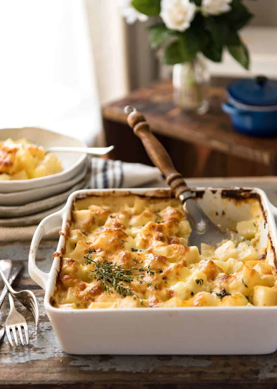 A faster, cheesier, creamier alternative to Scalloped Potatoes / Potato Gratin, this Easy Creamy Cheesy Potato Bake is made with cubed potatoes cooked in a cream and cheese sauce. dev.recipetineats.com