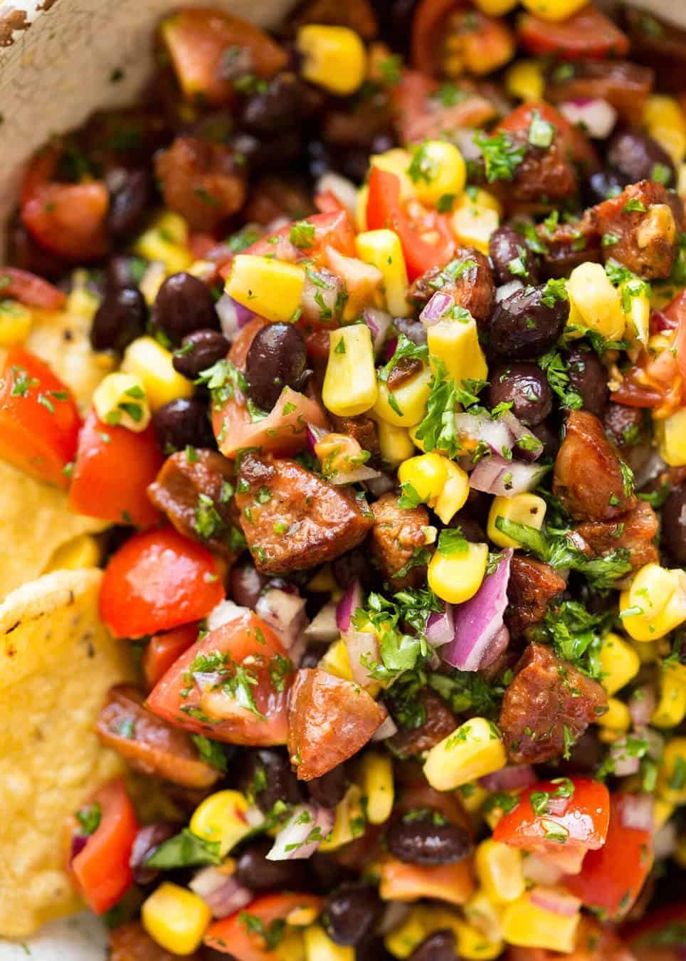 I call this a PIG OUT Salsa. Sensible people would call it an Chorizo, Black Bean and Corn Salsa. :) dev.recipetineats.com