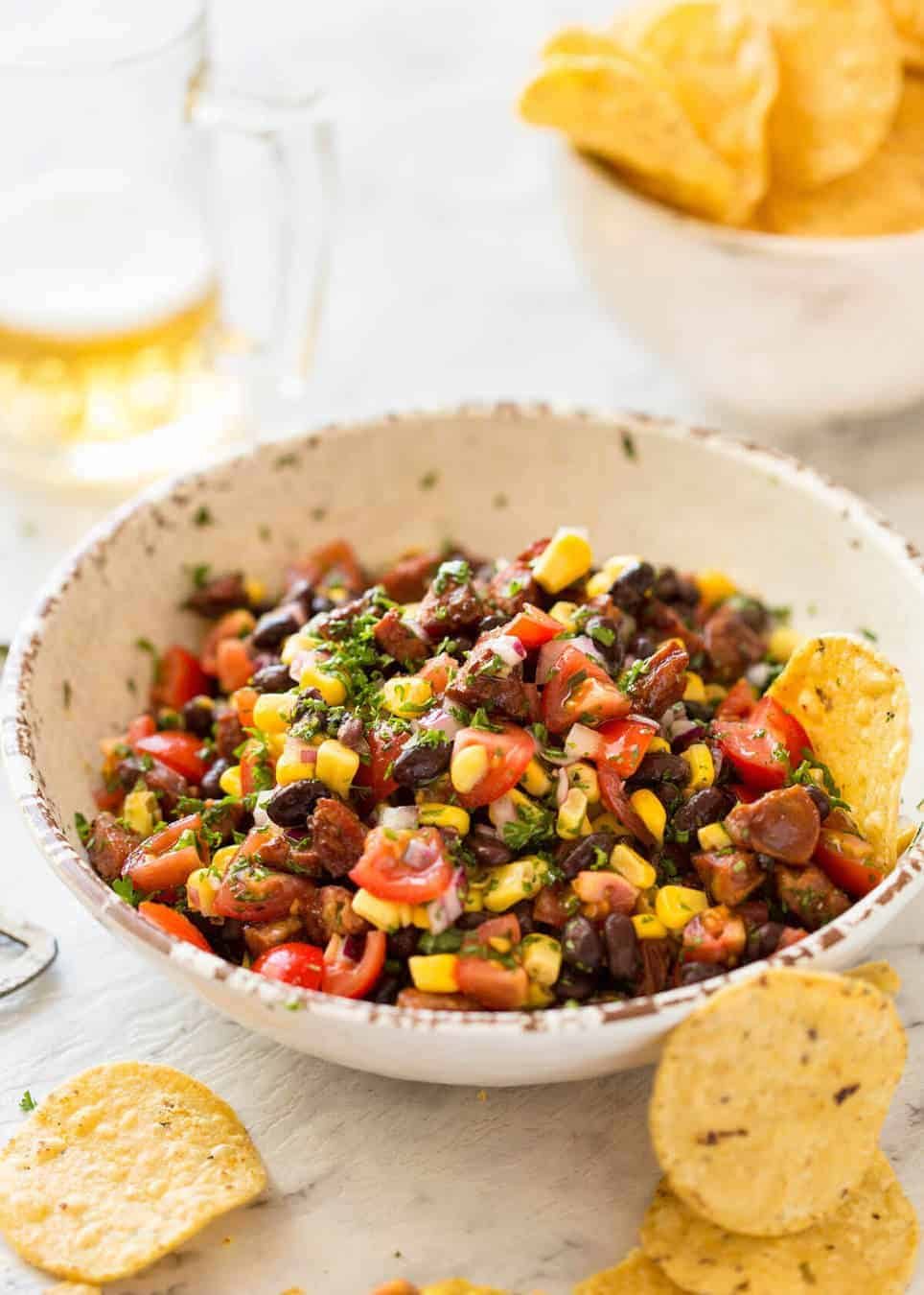 I call this a PIG OUT Salsa. Sensible people would call it an Chorizo, Black Bean and Corn Salsa. :) dev.recipetineats.com