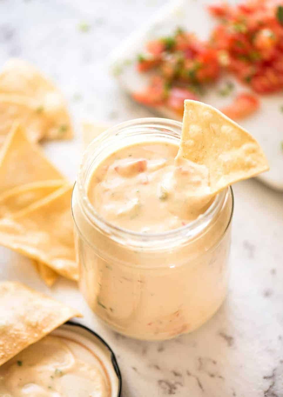 Code cracked: Queso Dip made with real cheese that's ultra silky even when it cools. dev.recipetineats.com