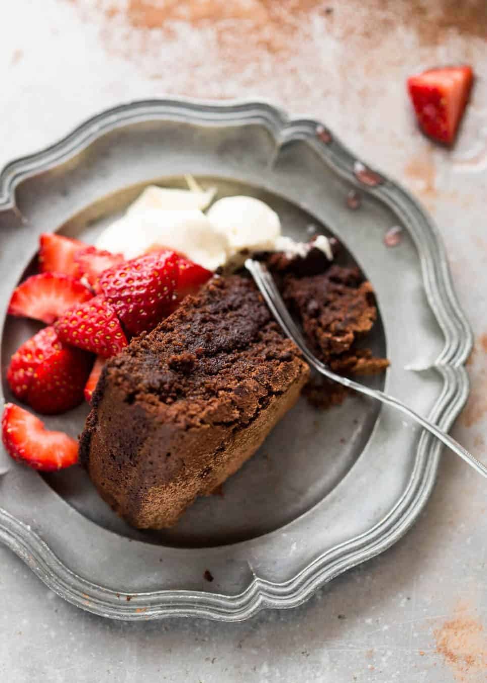 A simple Flourless Chocolate Cake made with almond meal / almond flour. Moist inside, with a thin crackly brownie-like surface. A stunning, very quick cake to make! dev.recipetineats.com