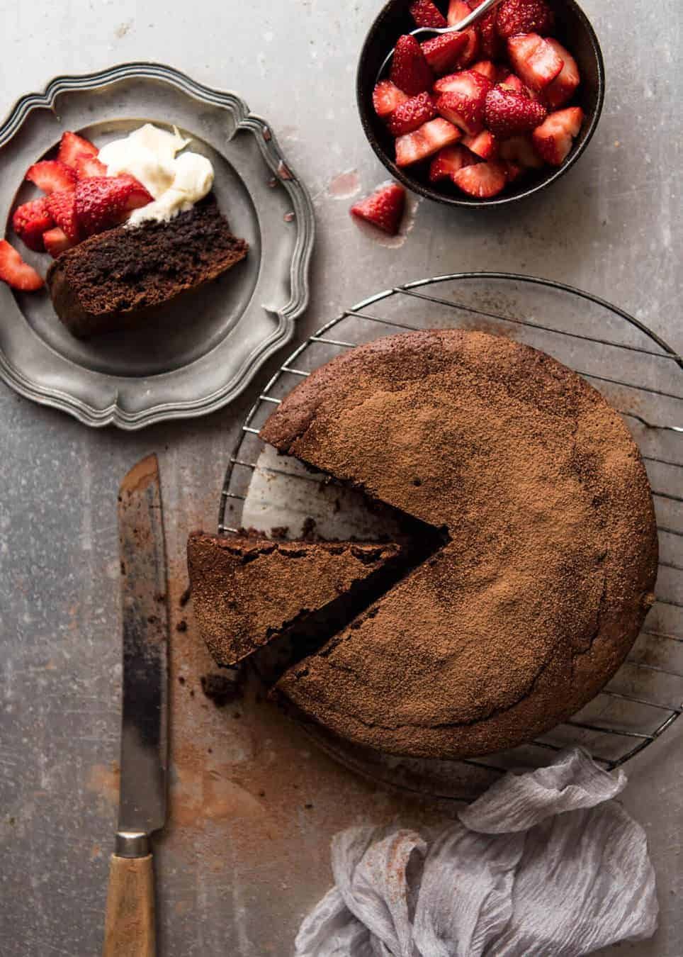 A simple Flourless Chocolate Cake made with almond meal / almond flour. Moist inside, with a thin crackly brownie-like surface. A stunning, very quick cake to make! dev.recipetineats.com
