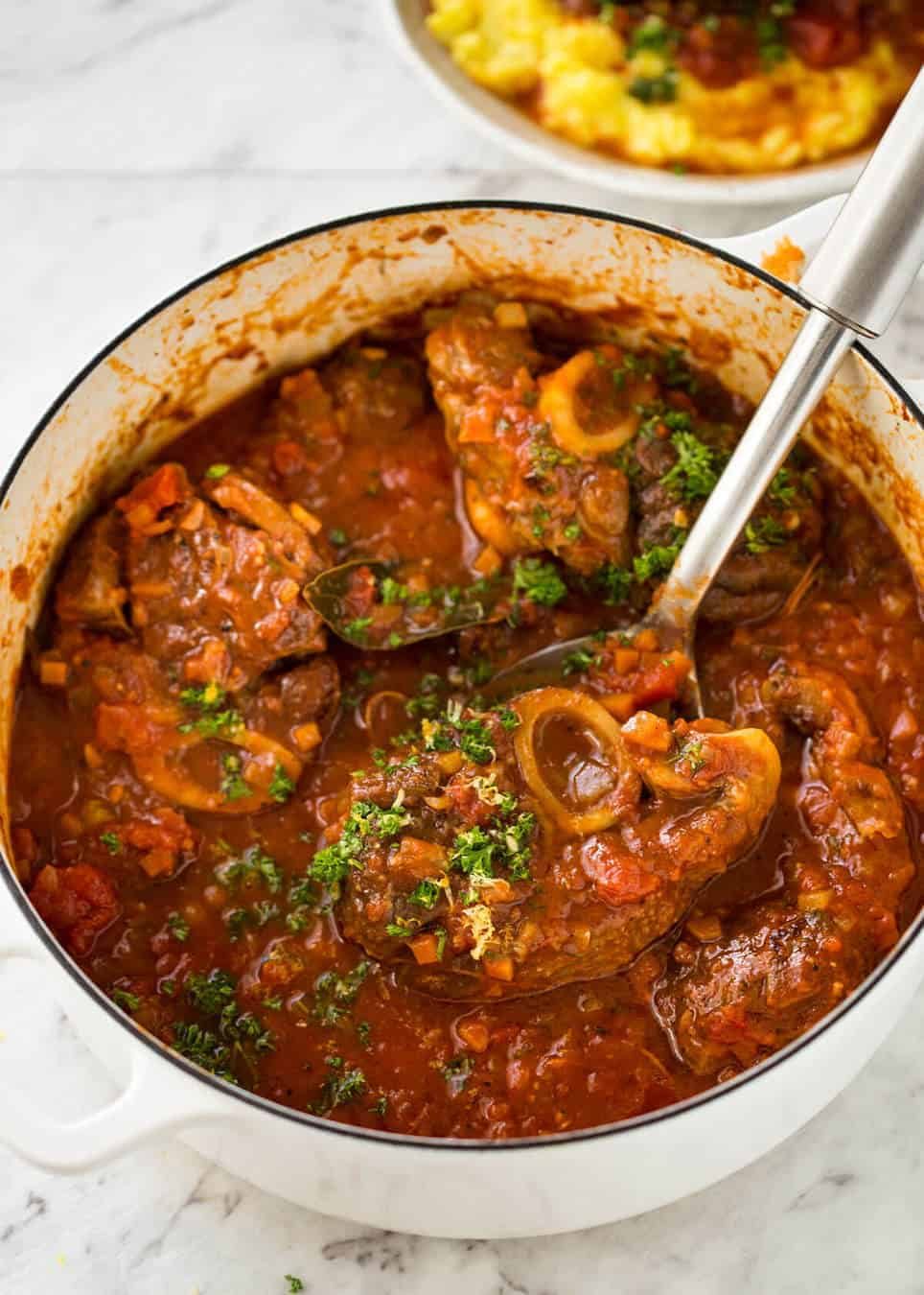 Fork tender veal braised in a rich red sauce, Osso Buco is a meal fit for a king! dev.recipetineats.com